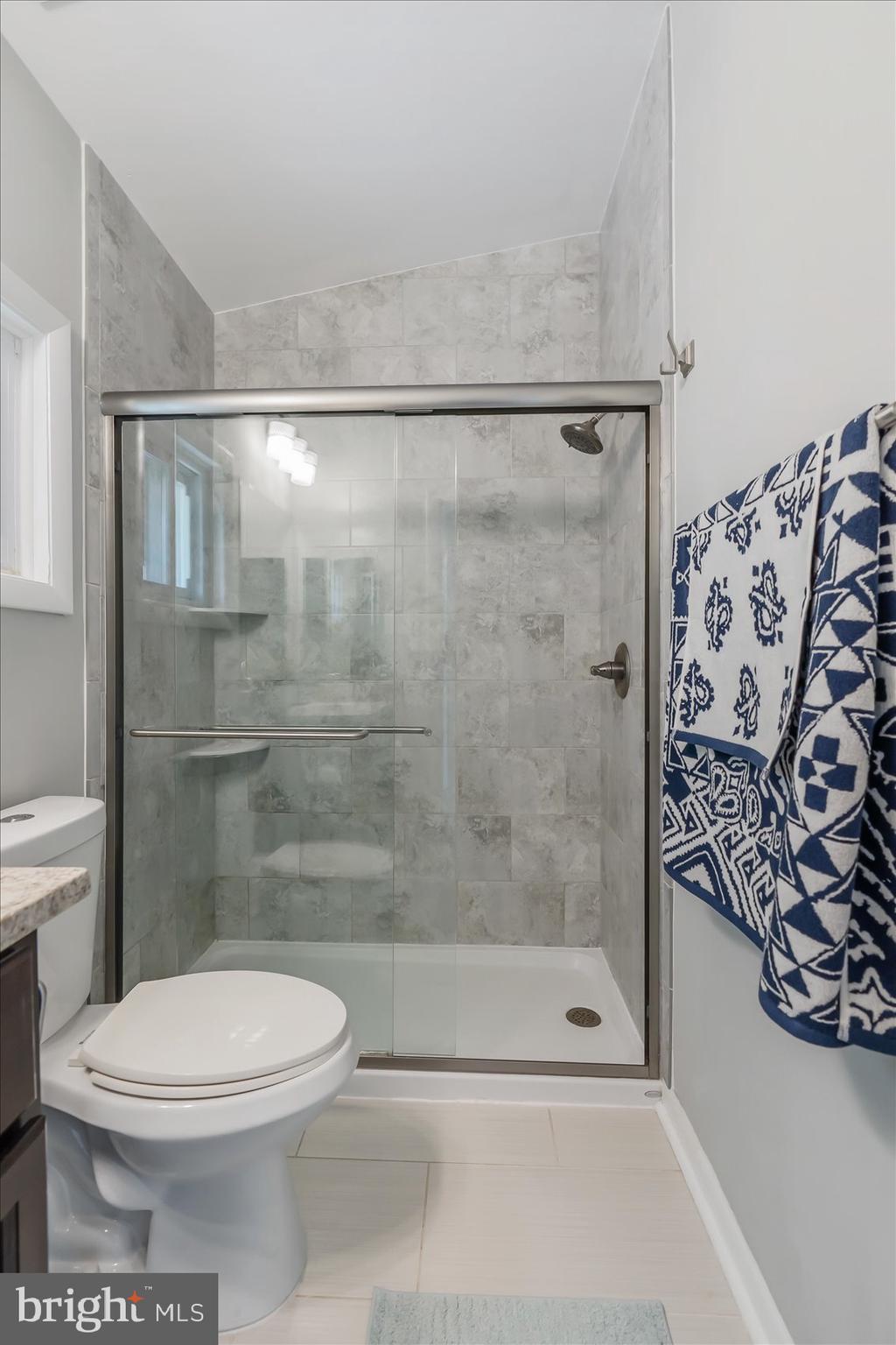 5818 Stuart Avenue Baltimore, MD 21215 - Photo 24 of 64 Remodeled and updated primary bath.
