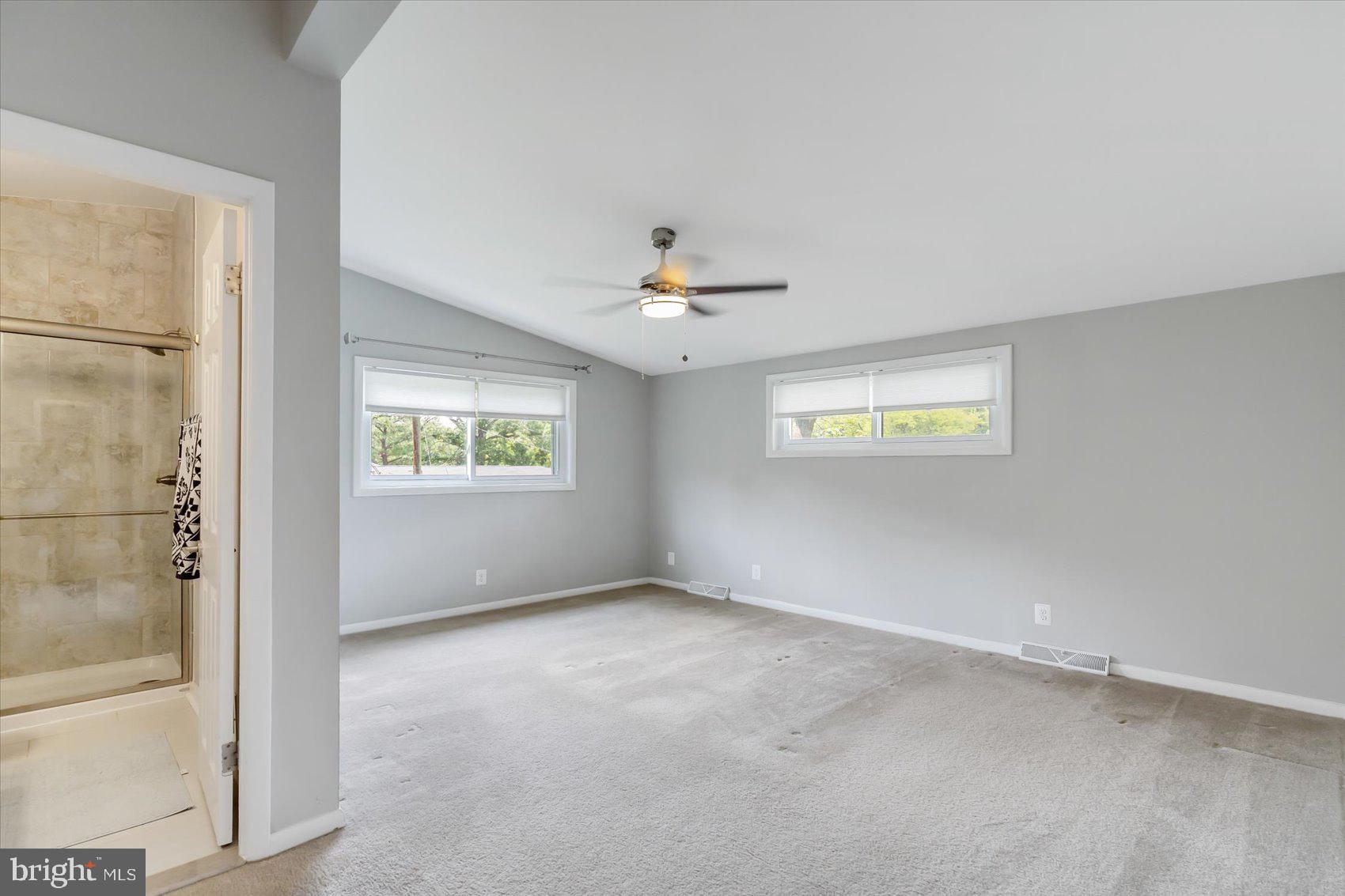 5818 Stuart Avenue Baltimore, MD 21215 - Photo 27 of 64 Primary bedroom w/ ceiling fan and privacy windows