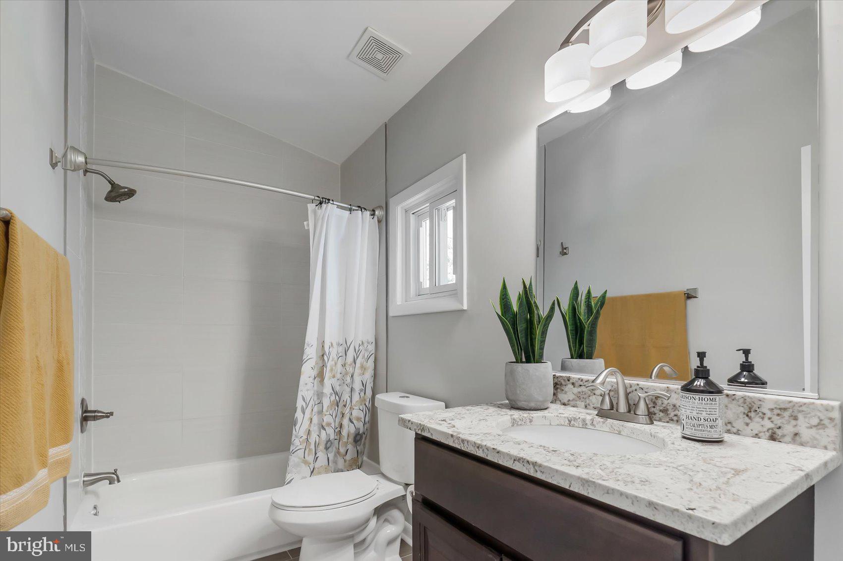 5818 Stuart Avenue Baltimore, MD 21215 - Photo 35 of 64 Remodeled and updated bath on top level.