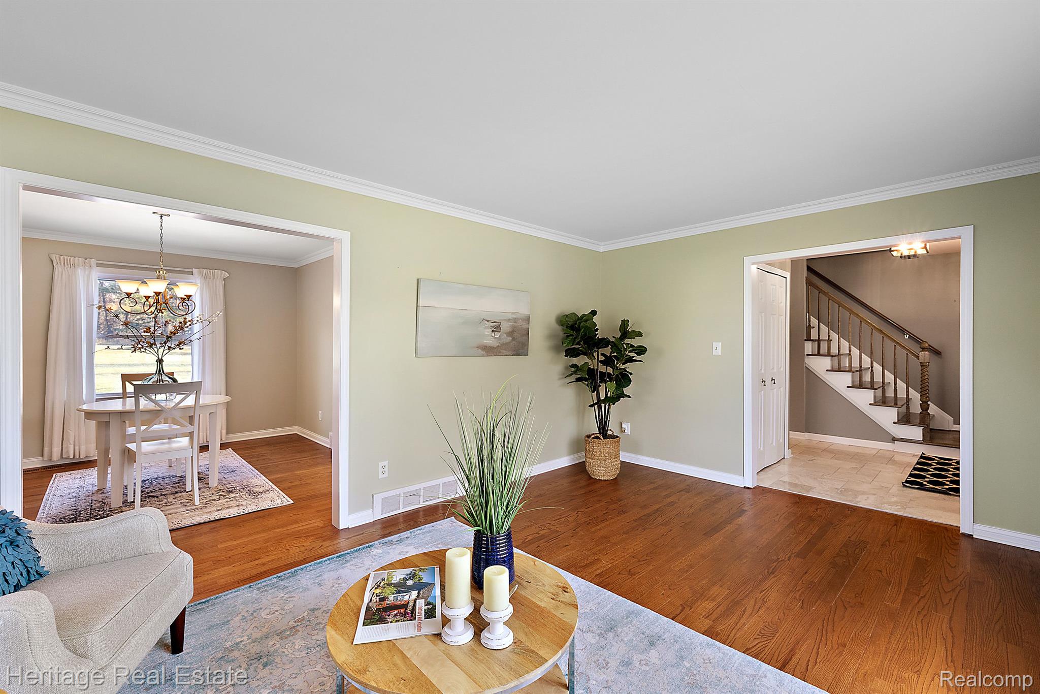 7756 Holcomb Road Clarkston, MI 48348 - Photo 17 of 36 Living foom features wood floors and crown molding