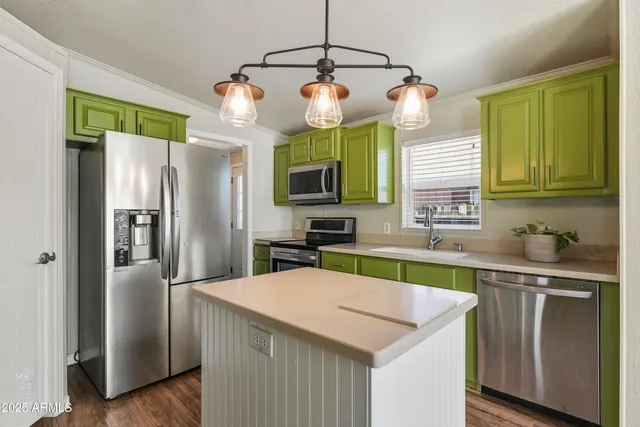 a view of a livingroom with wooden floor and windows
