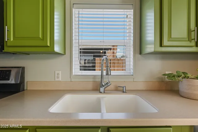 a bathroom with a sink double vanity and a mirror