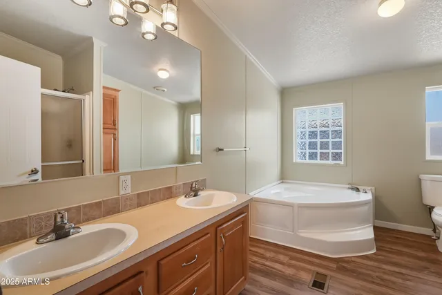 a bathroom with a sink double vanity and a mirror