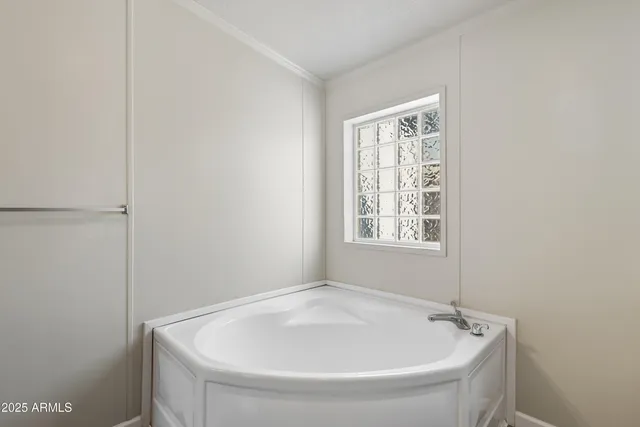 a white bath tub sitting in a bathroom