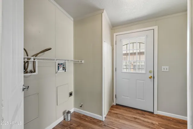 a view of a room with wooden floor and closet