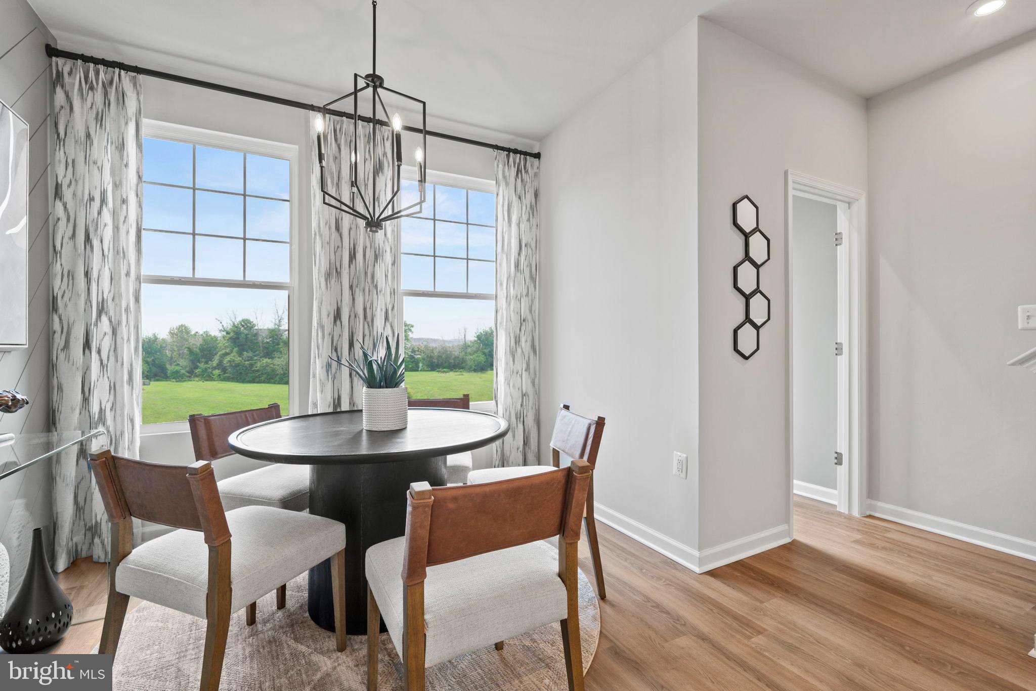 352 Anthem Street, Unit 443 Ranson, WV 25438 - Photo 61 of 87 a view of a dining room with furniture window and outside view
