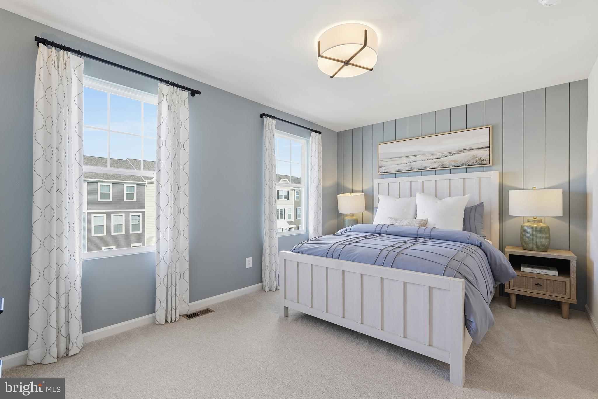 352 Anthem Street, Unit 443 Ranson, WV 25438 - Photo 63 of 87 a bedroom with a large bed and a chandelier