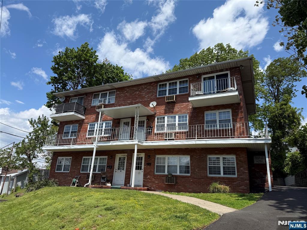 419 Paterson Avenue East Rutherford, NJ 07073 - Photo 2 of 5 a front view of a house with garden