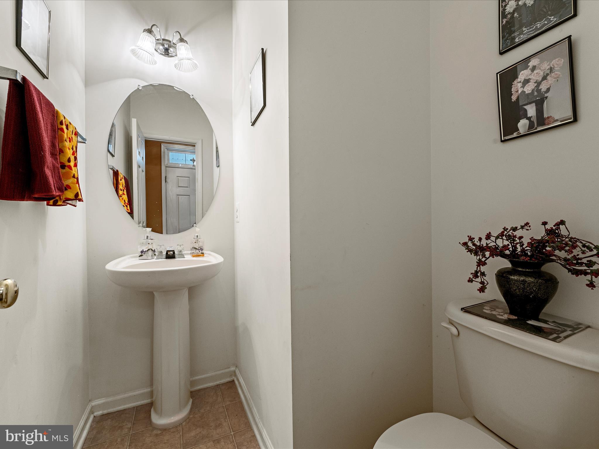 5540 Hobsons Choice Loop Manassas, VA 20112 - Photo 11 of 50 a bathroom with a sink mirror and toilet