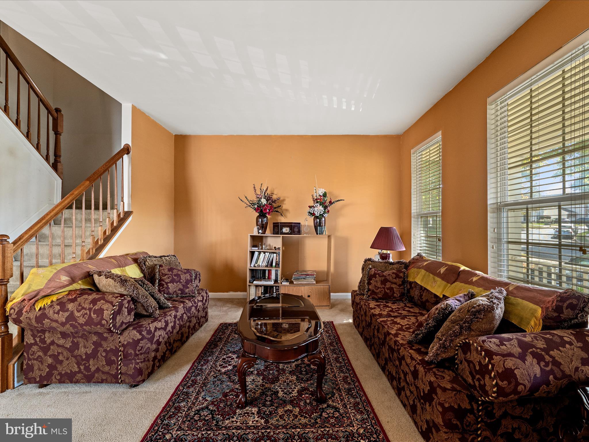 5540 Hobsons Choice Loop Manassas, VA 20112 - Photo 13 of 50 a living room with furniture and a floor to ceiling window