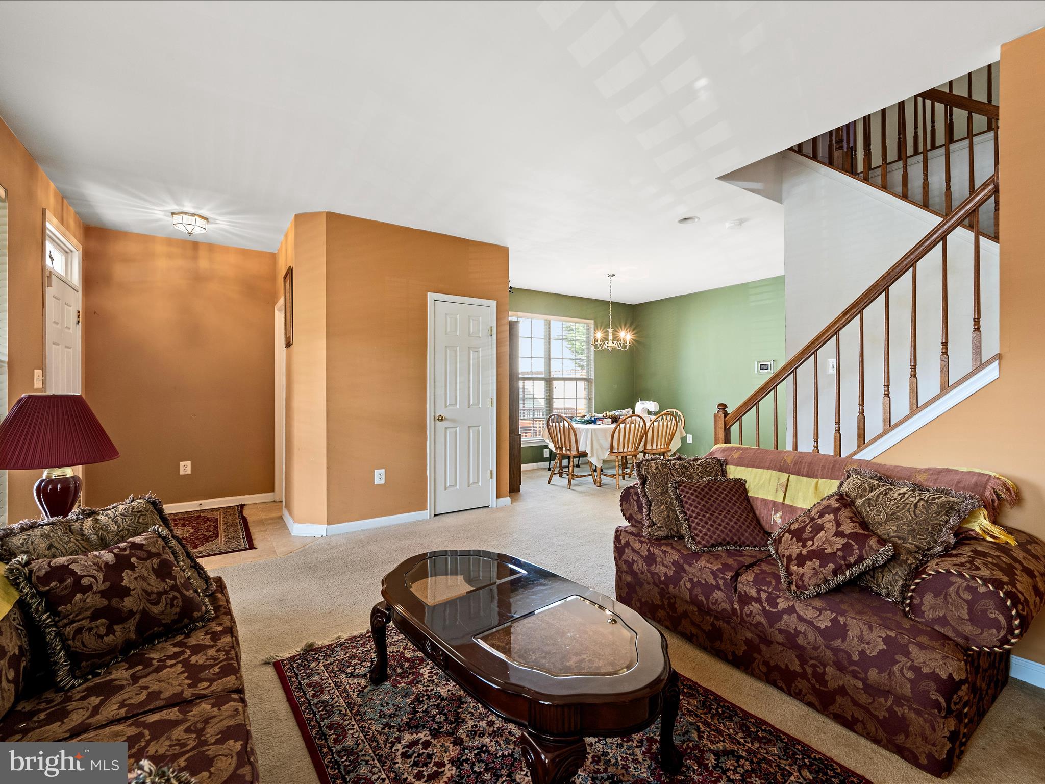 5540 Hobsons Choice Loop Manassas, VA 20112 - Photo 14 of 50 a living room with furniture and a dining table