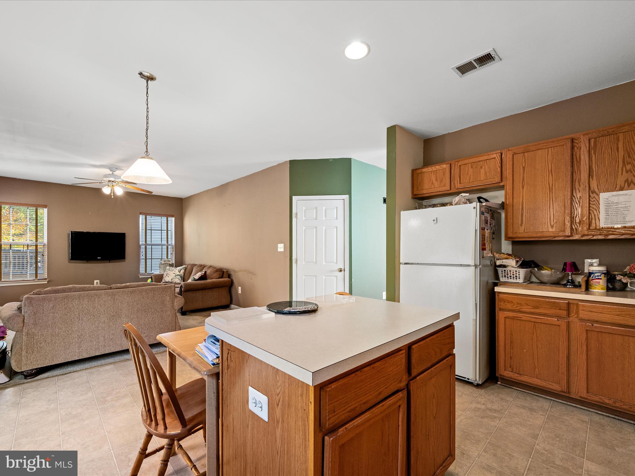5540 Hobsons Choice Loop Manassas, VA 20112 - Photo 21 of 50 a kitchen that has a cabinets a sink and a refrigerator