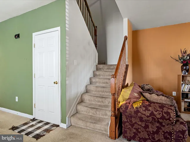 a bathroom with a sink a toilet and shower curtain