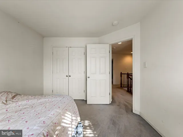 a bed room with a bed and a tv