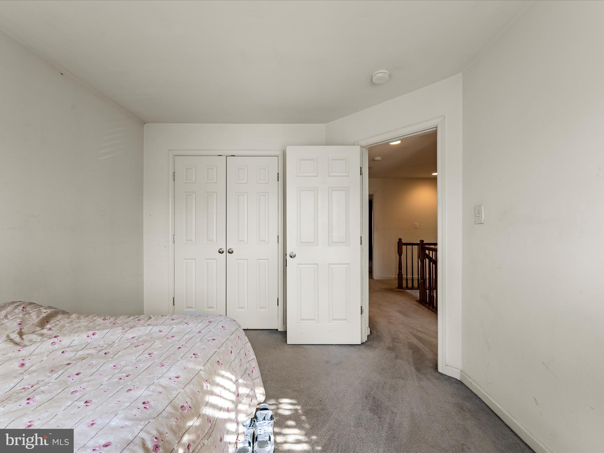 5540 Hobsons Choice Loop Manassas, VA 20112 - Photo 30 of 50 a bedroom with a bed and a hallway