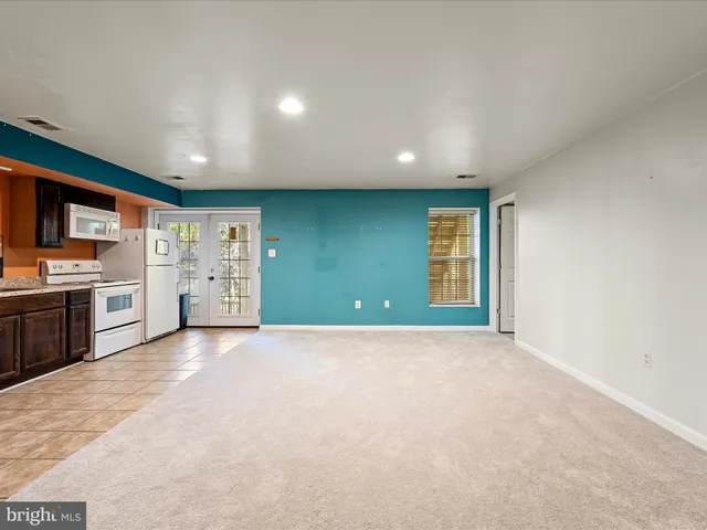 a kitchen with stainless steel appliances granite countertop a stove and a sink