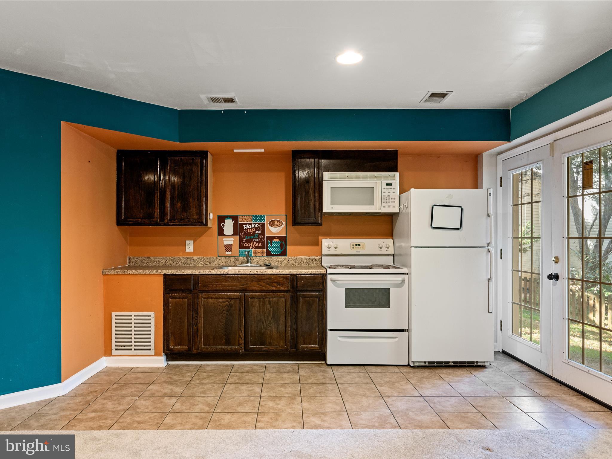5540 Hobsons Choice Loop Manassas, VA 20112 - Photo 40 of 50 a kitchen with stainless steel appliances granite countertop a stove and a sink