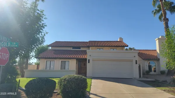 a front view of a house with a garage