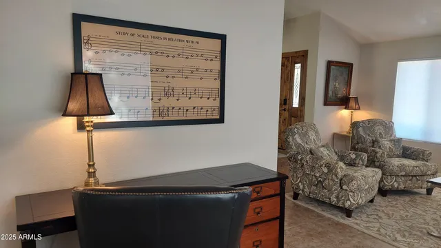 a living room with furniture and a window