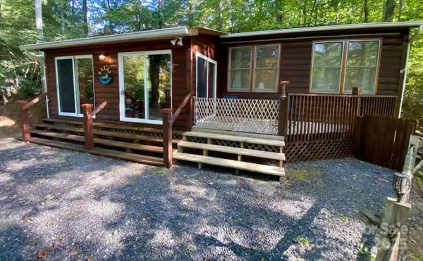 a view of a two room with wooden floor and outdoor space