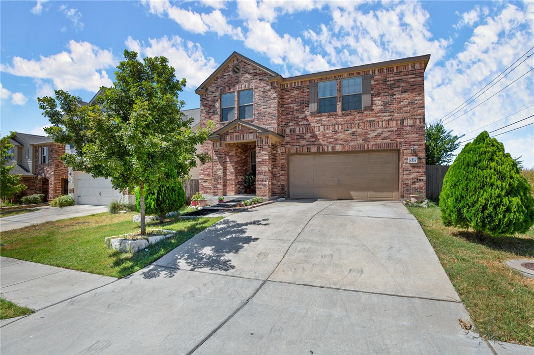 6201 Minnoch Lane Austin, TX 78754 - Photo 1 of 1 a front view of a house with a yard and garage