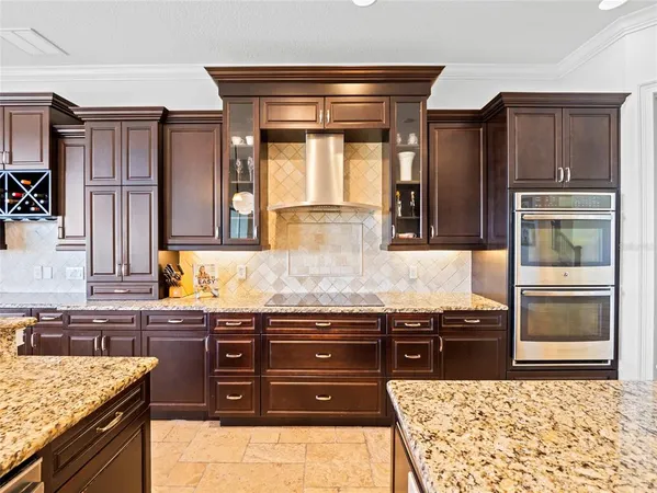 a kitchen with stainless steel appliances granite countertop a stove and a sink