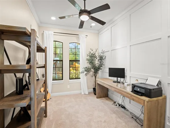 a room with furniture a flat screen tv and a window