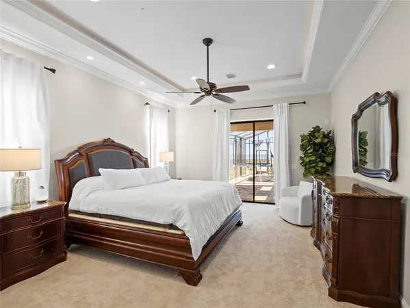 a bedroom with a bed dresser and window