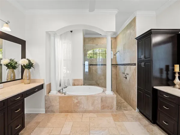a spacious bathroom with a tub shower and sink