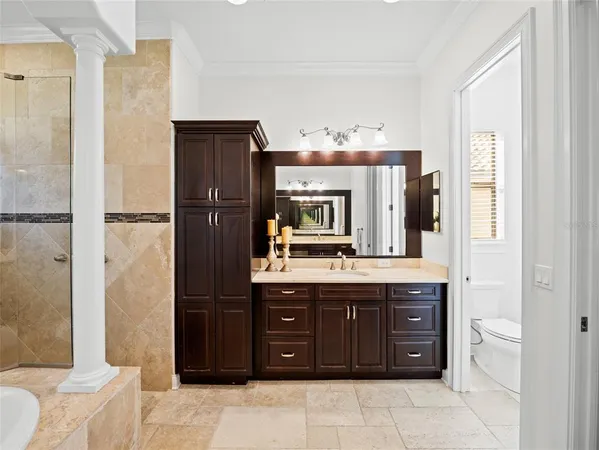 a kitchen with a refrigerator and cabinets