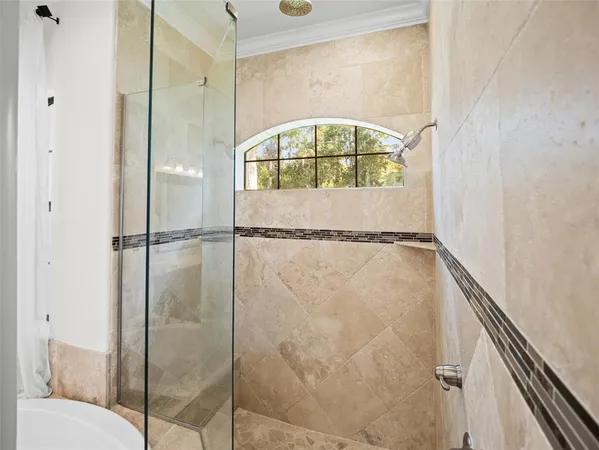 a bathroom with a bathtub and a shower