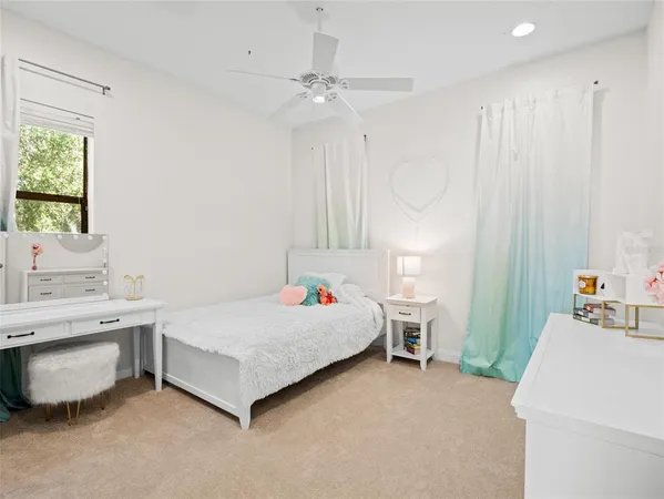 a room with a bed and a table in it