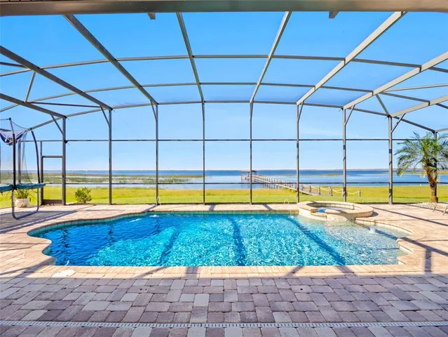 a view of swimming pool from a yard