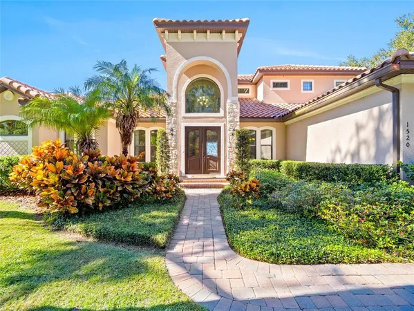 front view of a house with a garden