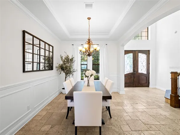 a dining room with furniture and window