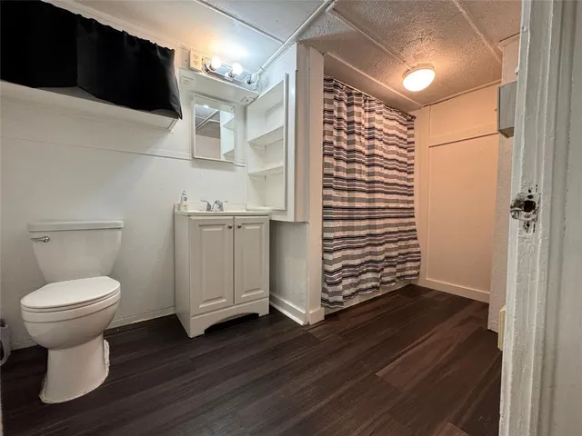 a bathroom with a toilet and a sink