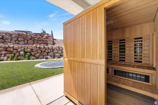 1192 East Corral Way Washington, UT 84780 - Photo 59 of 81 Integrated outdoor sauna with a natural wood interior and slatted benches