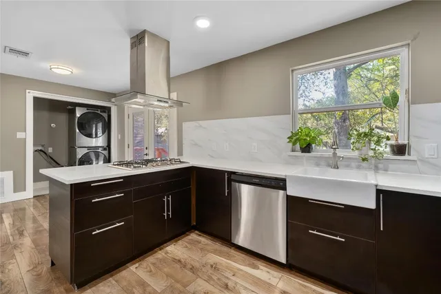a kitchen with a sink and cabinets