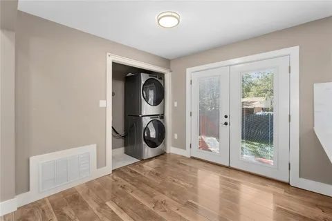 a view of a hallway with washer and dryer