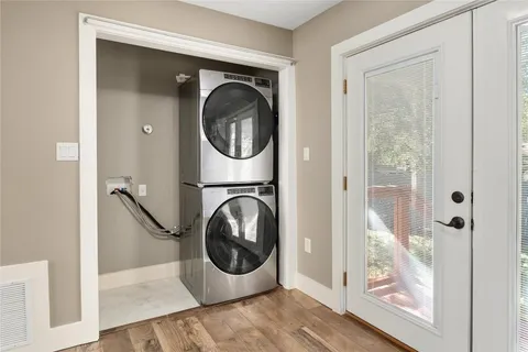 a view of a hallway with washer and dryer