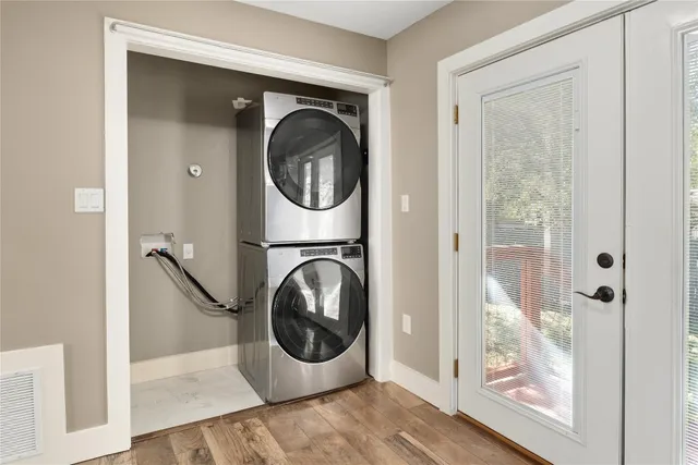 a view of a hallway with washer and dryer