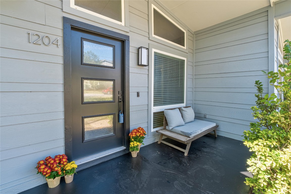 1204 Eleanor Street Austin, TX 78721 - Photo 2 of 27 a outdoor living space with furniture and flowers