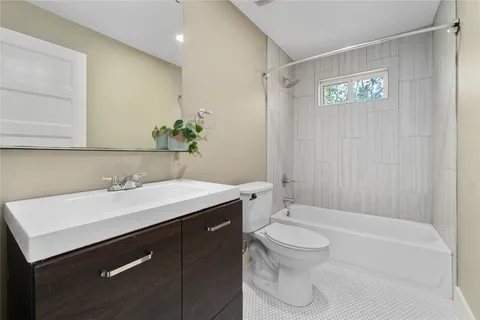 a bathroom with a sink a toilet and a bathtub