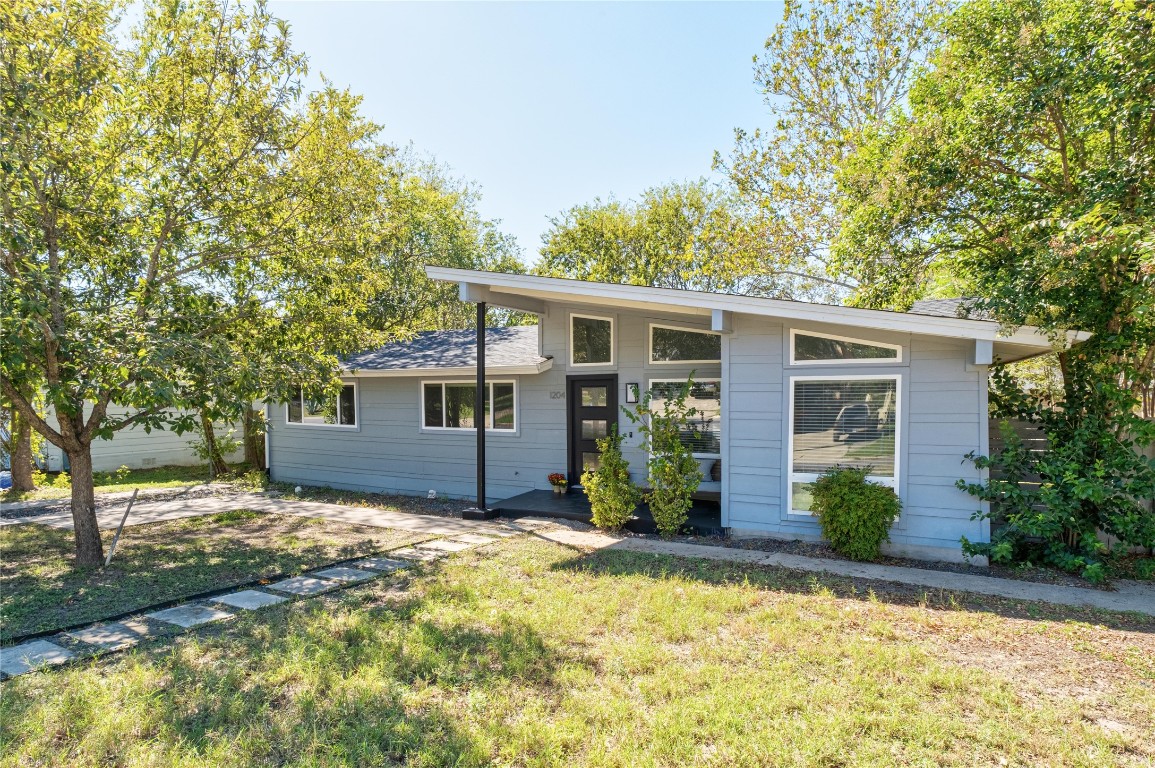 1204 Eleanor Street Austin, TX 78721 - Photo 3 of 27 a view of a house with backyard and sitting area