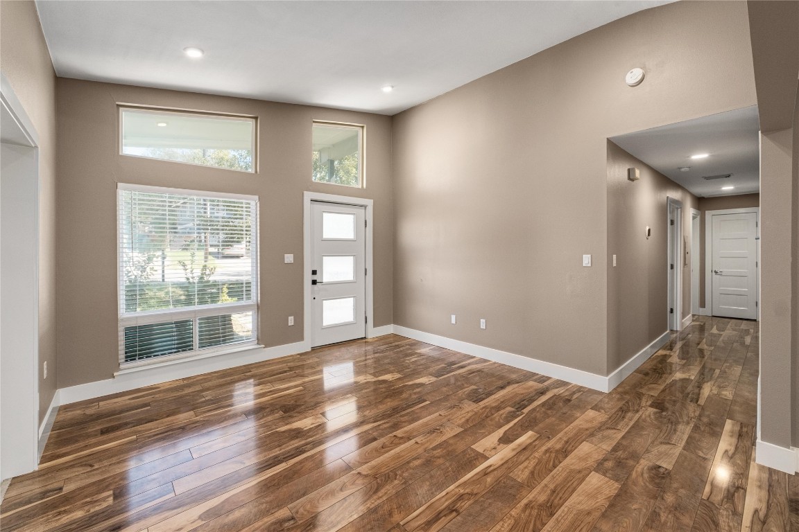 1204 Eleanor Street Austin, TX 78721 - Photo 6 of 27 a view of empty room with wooden floor and fan