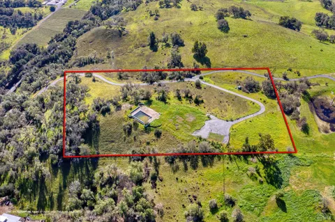 a view of a lake with a building in the background