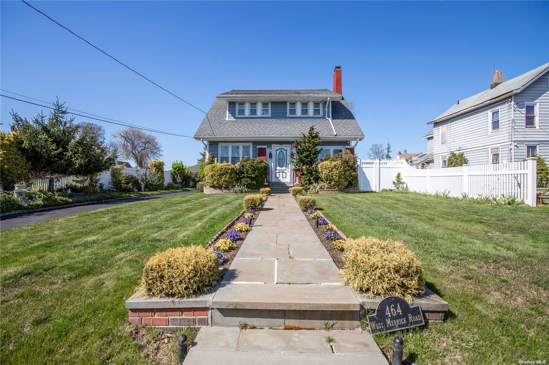 464 West Merrick Road Freeport, NY 11520 - Photo 1 of 1 a front view of a house with garden