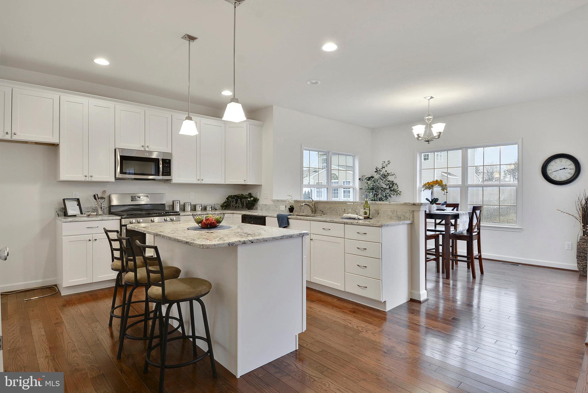 218 Carroll Road Pasadena, MD 21122 - Photo 7 of 37 Example of kitchen overlooking sun room