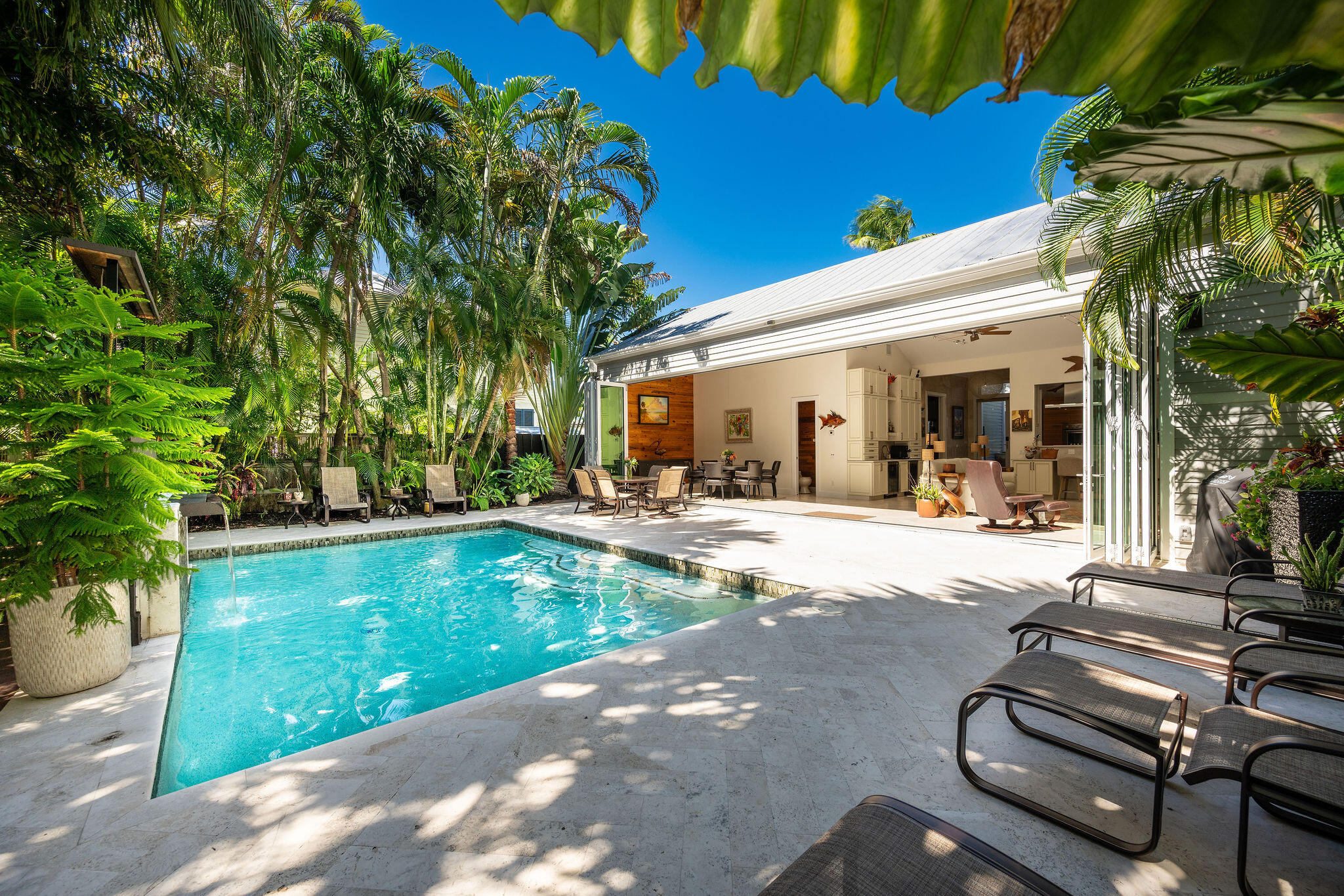 1006-1008 Fleming Street Key West, FL 33040 - Photo 1 of 48 a view of swimming pool with lawn chairs and plants