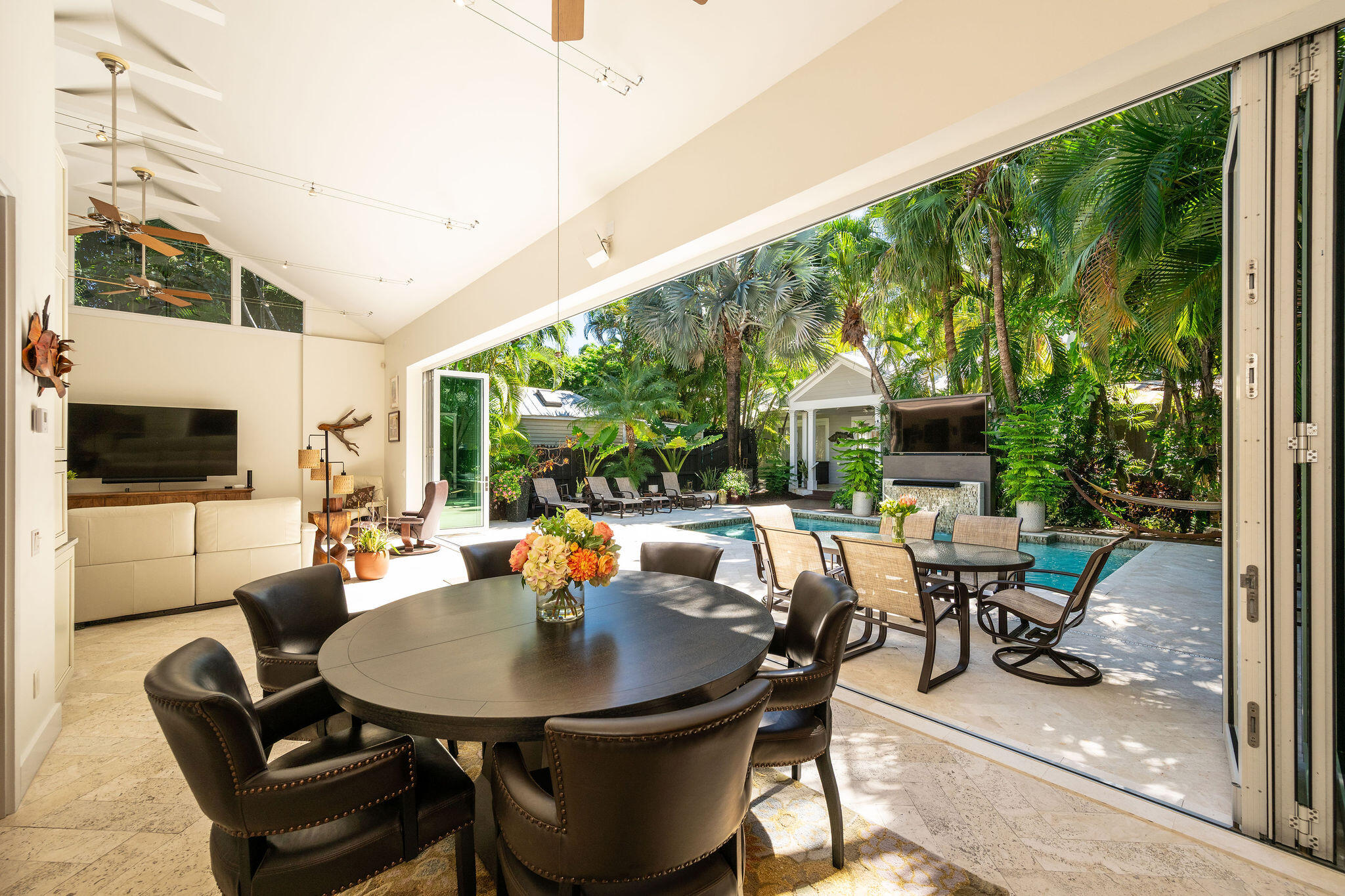 1006-1008 Fleming Street Key West, FL 33040 - Photo 15 of 48 a view of a patio with a dining table and chairs
